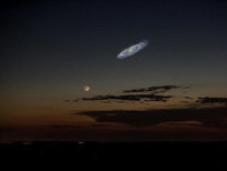Andromeda Galaxy contains hundreds of billions of solar systems and is the largest object in our night sky but is too dim to see with the naked eye